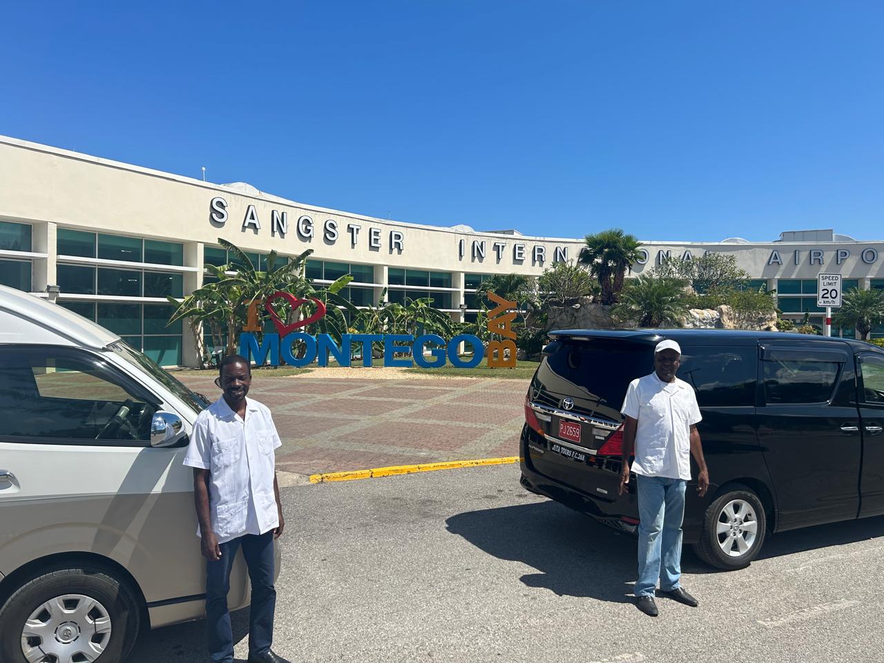 Couple at Negril sign